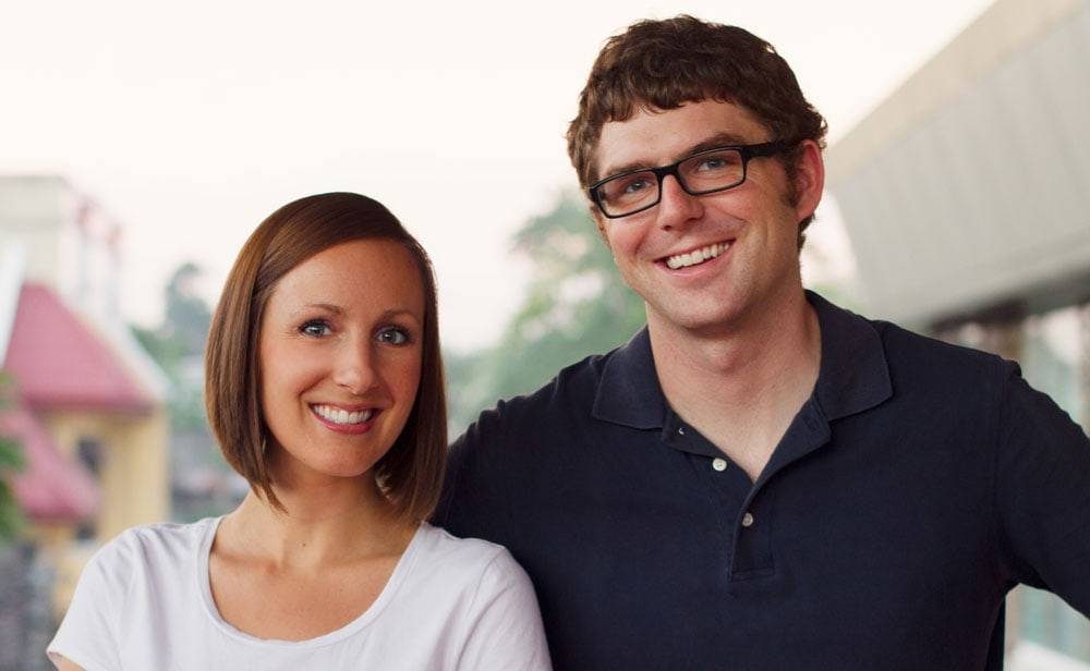 Man and woman smiling.