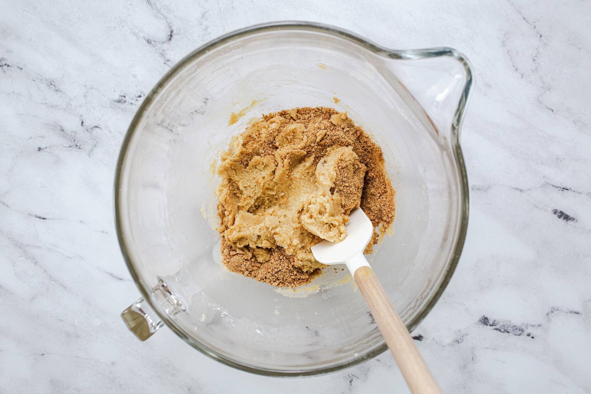 Mixing cookie batter in a bowl.
