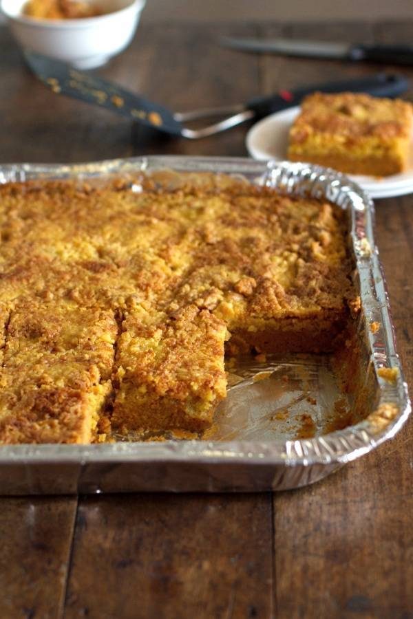 Pumpkin dessert bars  in a tin dish.