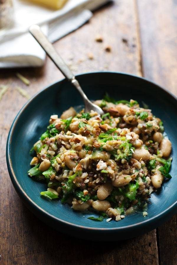 Broccoli Cheese Rice in a blue bowl with a fork.