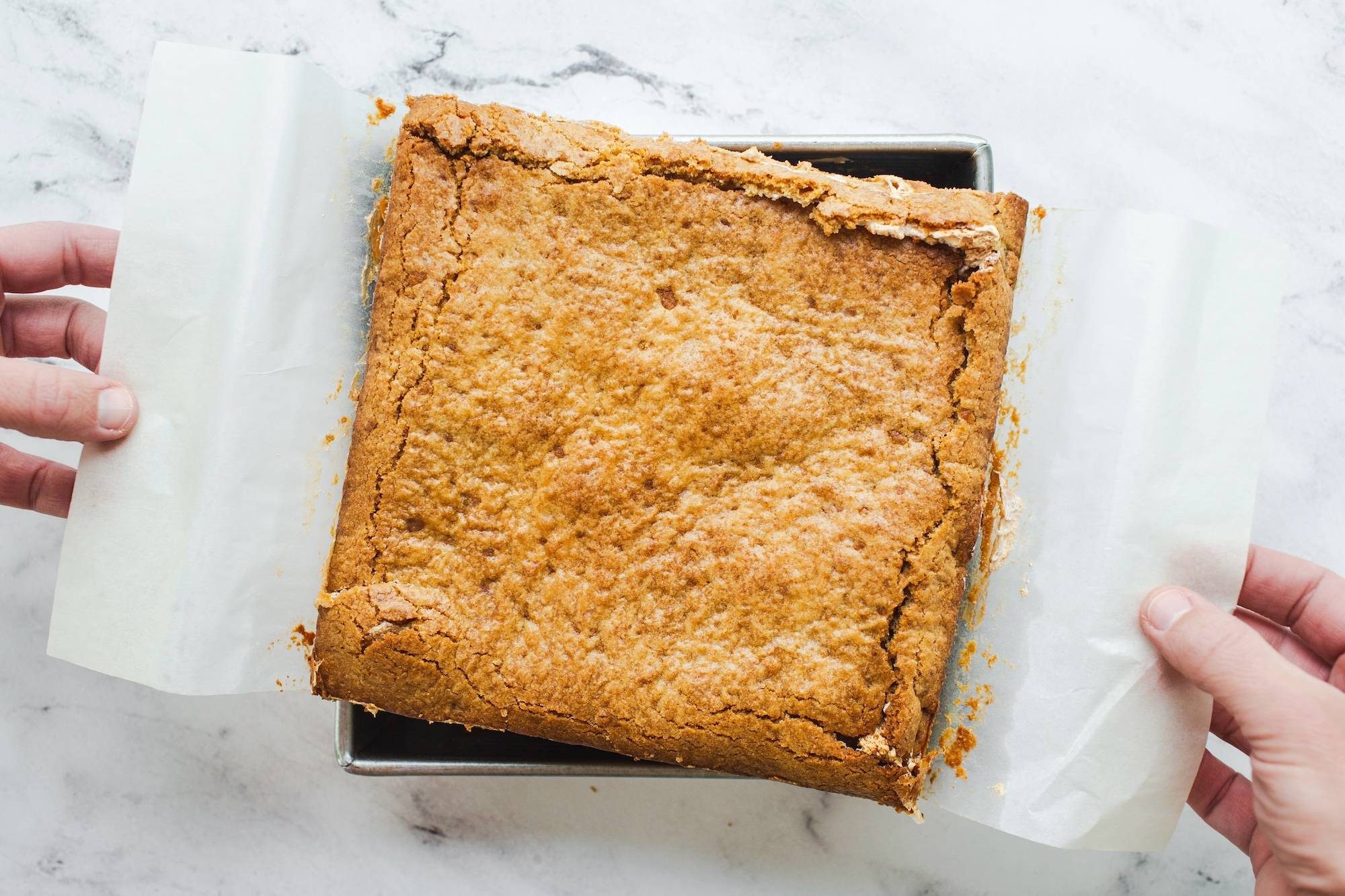 S'mores bars lifted out of pan.
