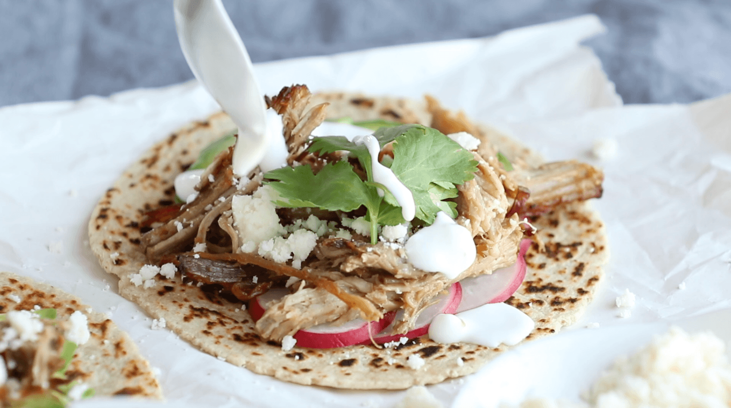 Assembled carnitas taco.