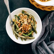 Green bean casserole on a plate with a fork.