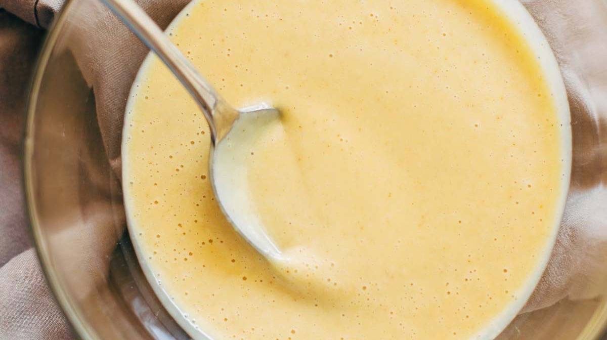 5 Minute Honey Mustard Sauce in a bowl with a spoon.