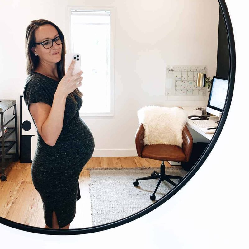 Lindsay taking selfie in an office.