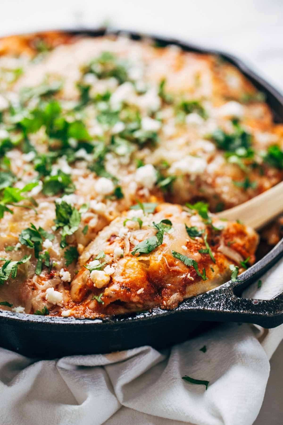 Chicken Tortilla Pie in a skillet and on a wooden spoon.