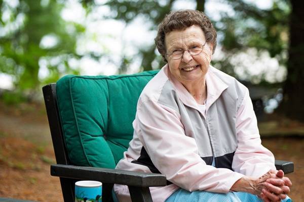 Elderly woman in a chair.