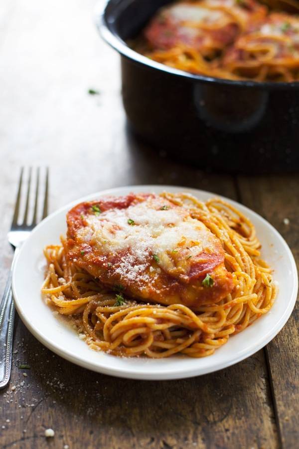 Chicken Pizzaiola on a white plate with a fork.