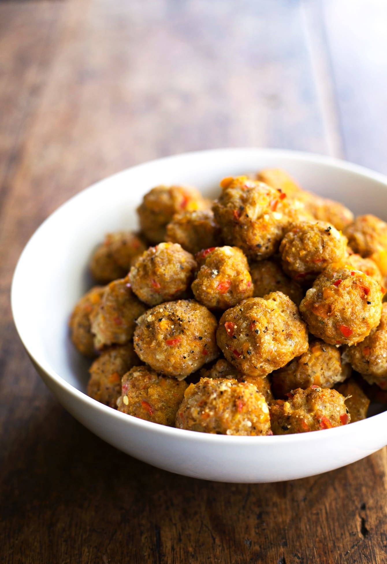 Meatballs in a white bowl.