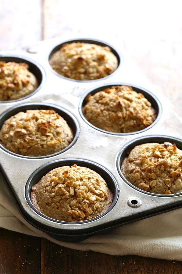 Caramelized Banana Oat Muffins in a muffin tin.