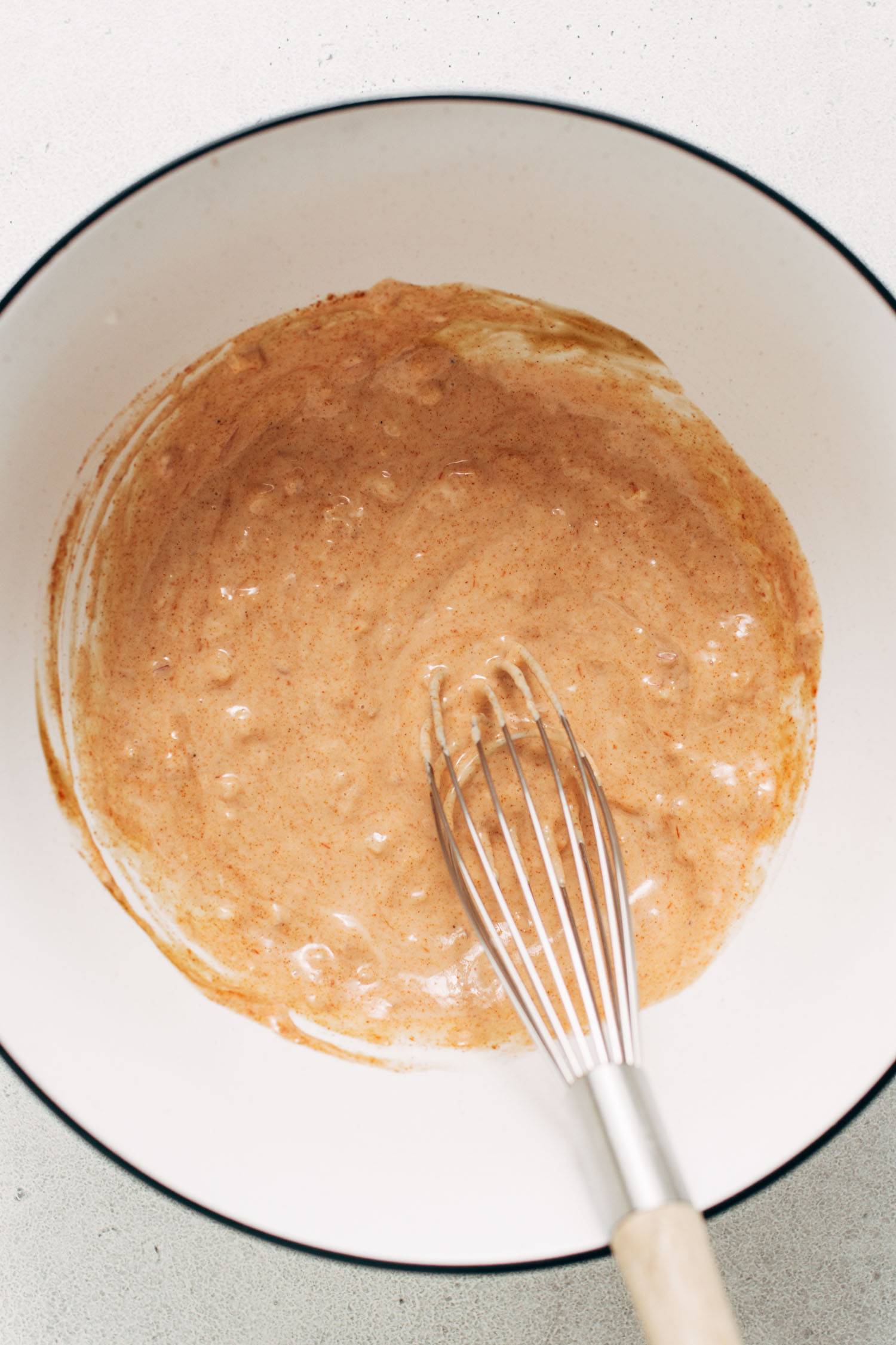 House sauce whisked up in a bowl.